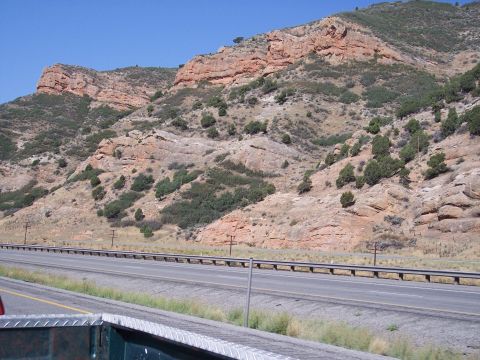 1972 Ford Ranchero - Mountain scenery along a highway, with sparse vegetation on the slopes.