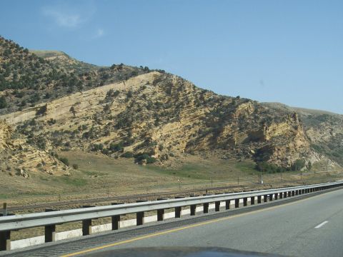 1972 Ford Ranchero - Scenic view of a mountain landscape alongside a highway on a clear day.