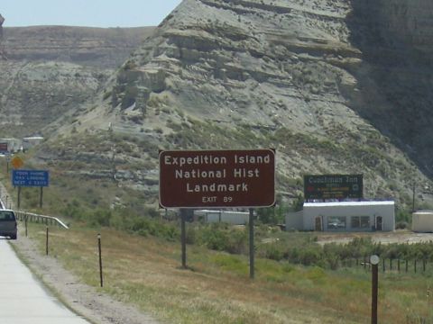 1972 Ford Ranchero - Signs indicate Expedition Island National Historic Landmark and Coachman Inn are accessible via Exit 89.