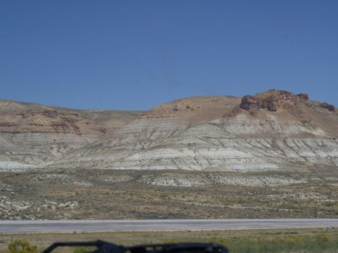 1972 Ford Ranchero - Expansive desert scenery with prominent geological formations and a dry, flat foreground.