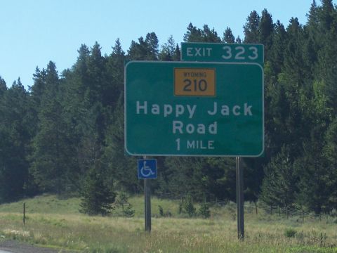1972 Ford Ranchero - A highway sign indicates Exit 323 for Happy Jack Road, 1 mile ahead, with a Wyoming route marker.