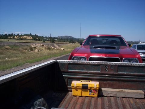 1972 Ford Ranchero - A red 1972 Ford Ranchero is seen from the perspective of a pickup truck bed.