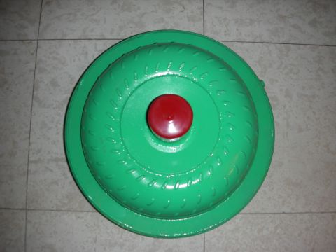 1992 Ford Crown Victoria - A green torque converter with a red center cap is shown against a tiled background.