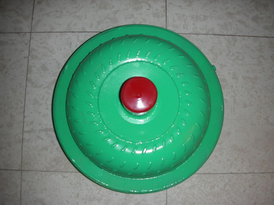Green torque converter with red center cap