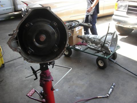 1992 Ford Crown Victoria - Transmission and torque converter removed from a vehicle, ready for service.