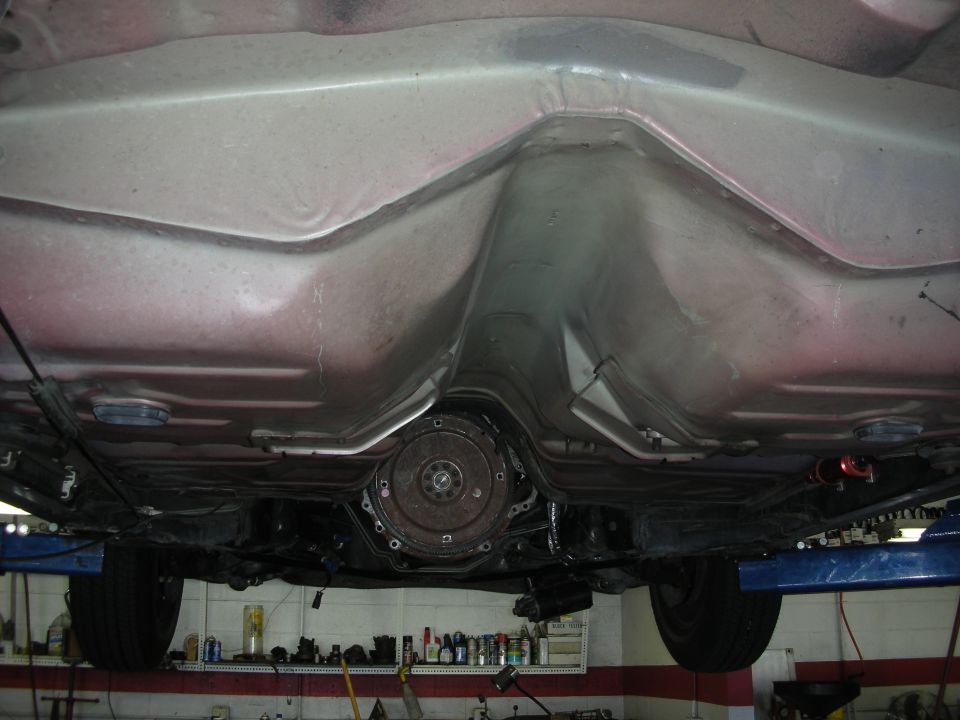 Underside view of a car's transmission and exhaust system