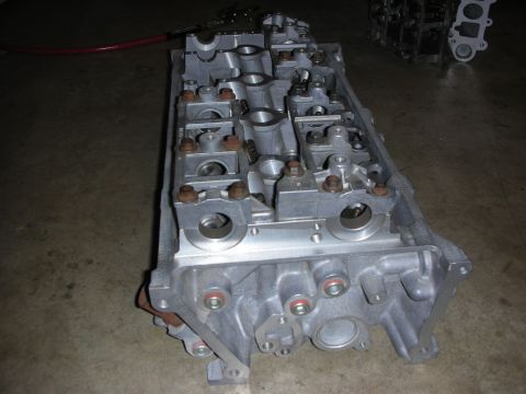 1998 Ford Crown Victoria - Close-up view of an engine cylinder head, likely for sale.