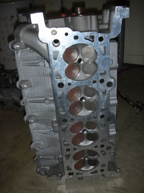 1998 Ford Crown Victoria - This is a close-up view of an engine cylinder head, showing the intake and exhaust valves.