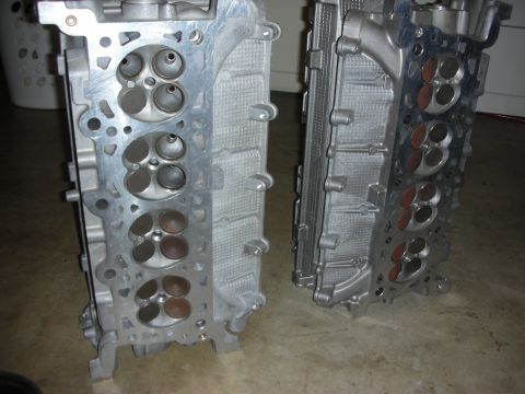 1998 Ford Crown Victoria - Two engine cylinder heads are shown, with the valves visible on each.