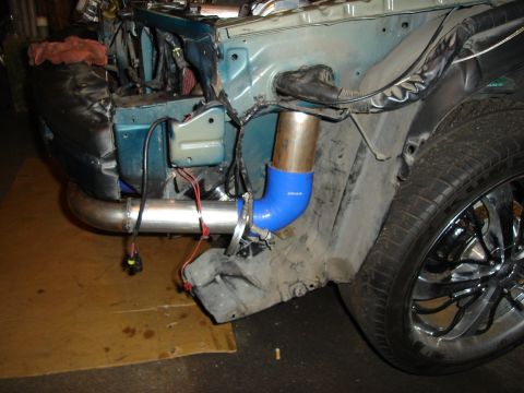 1995 Mazda MX-6 - Custom turbo piping installation in progress on a vehicle's front end.