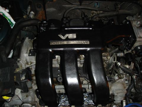 1995 Mazda MX-6 - Close-up of a V6 DOHC 24-valve engine intake manifold, likely from a project car.