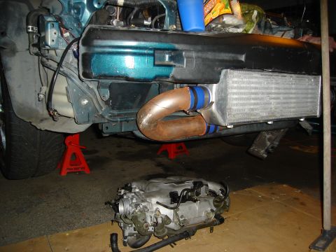 1995 Mazda MX-6 - Engine removed from car, showing intercooler and piping installation.