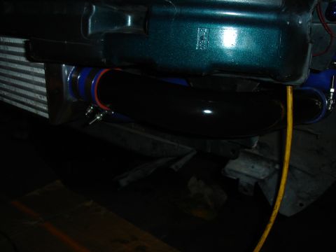 1995 Mazda MX-6 - Close-up view of intercooler piping and radiator components, with visible text at the bottom right.