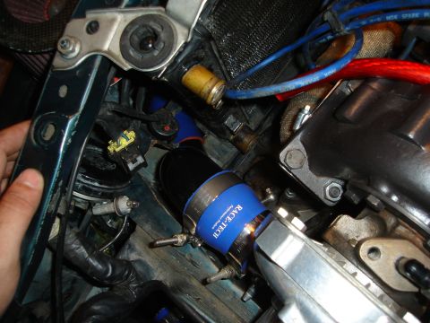 1995 Mazda MX-6 - Close-up of engine bay components, including Race-Tech branded turbo piping and various hoses and wires.