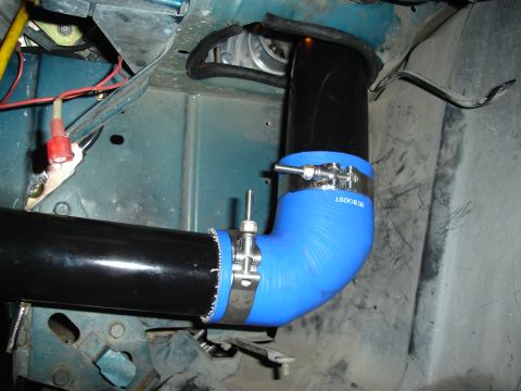 1995 Mazda MX-6 - Custom intake piping with blue silicone couplers and metal clamps is installed in the engine bay.