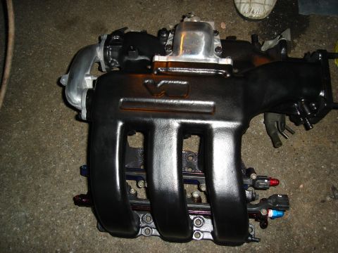 1995 Mazda MX-6 - Aftermarket intake manifold with "V6" cast into the side, likely for a performance build.