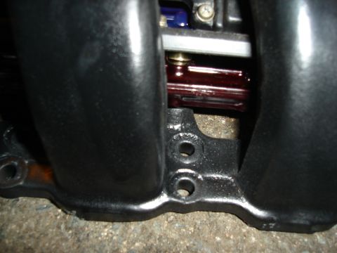 1995 Mazda MX-6 - A detailed view of an engine's intake manifold, showing its construction and mounting points.
