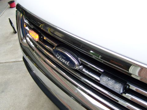 2003 Ford Crown Victoria - Front grille of a 2003 Ford Crown Victoria, modified with emergency lights.