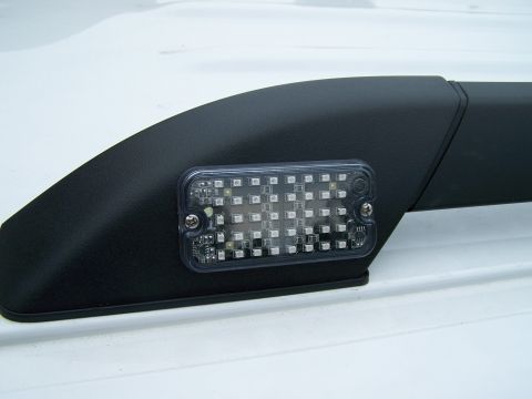 2003 Ford Crown Victoria - Aftermarket LED light bar installed on a vehicle's roof rack.
