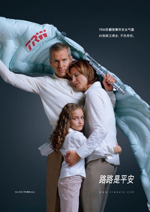 1999 Ford Taurus - TRW airbag advertisement showing a family protected by the safety device.