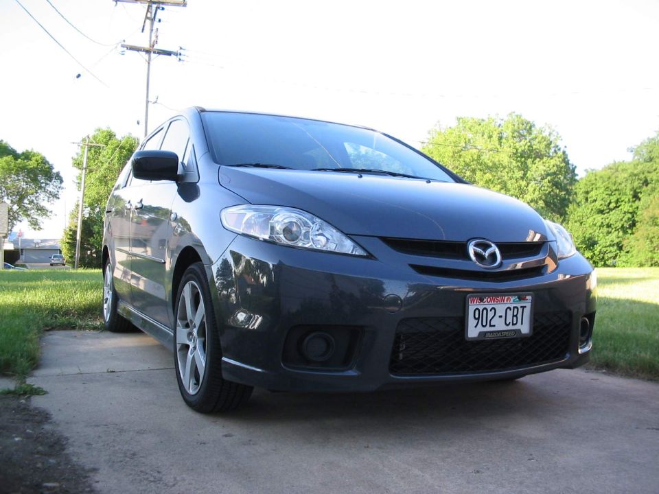 Dark gray 2006 Mazda 5 minivan parked on a driveway, front view