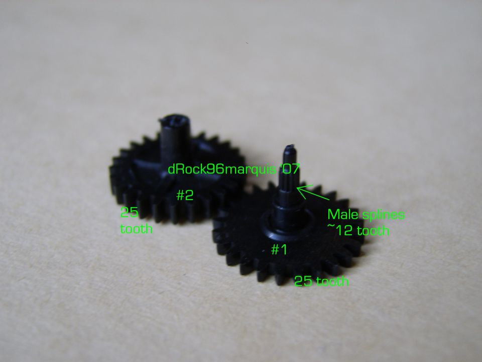 Two black plastic gears with tooth counts annotated in green