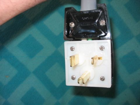 1995 Ford Bronco - This image shows a close-up view of an electrical plug and socket, not a vehicle.