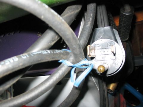 1995 Ford Bronco - Close-up of an electrical connector and bundled wires, secured with blue zip ties.