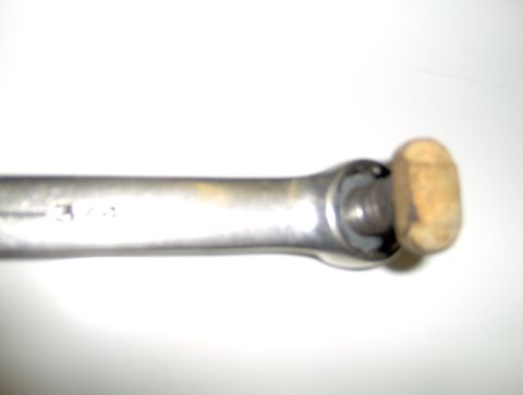 1978 Ford Bronco - A close-up view of a wrench with a wooden knob and "3/4" stamped on its shaft.