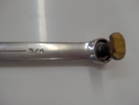 1978 Ford Bronco - A 3/4 wrench is shown with a bolt head secured in its mechanism.