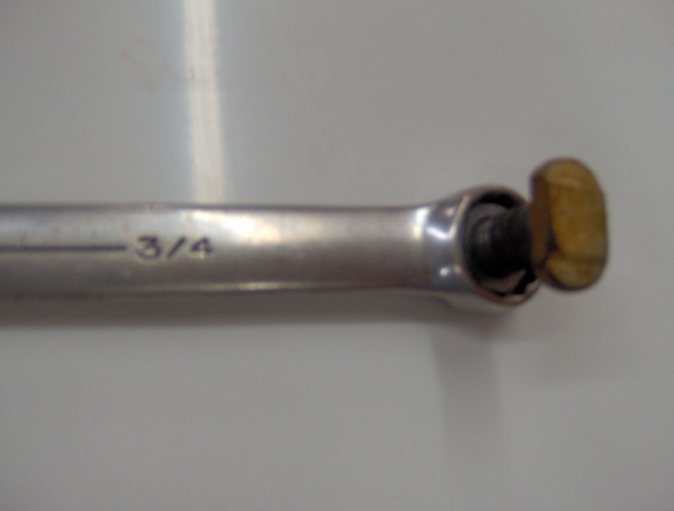 3/4 wrench holding a bolt head