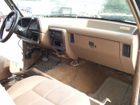 1989 Ford Bronco - Interior view of a 1989 Ford Bronco, highlighting the dashboard and seating area.