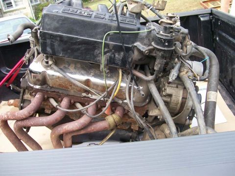 1989 Ford Bronco - A Ford V8 engine is shown, likely removed from a vehicle for repair or replacement.