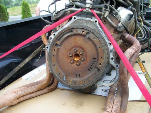 1989 Ford Bronco - A close-up view of a used engine, showing its internal components and exhaust system.