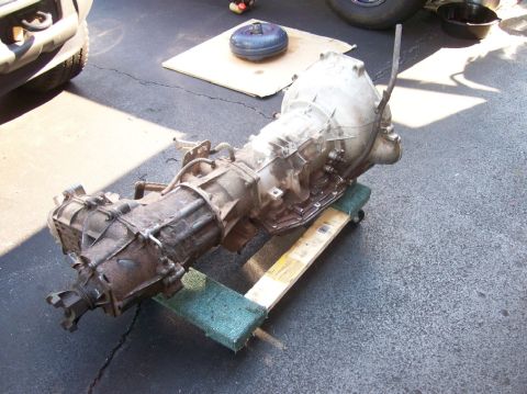 1989 Ford Bronco - Ford AOD automatic transmission removed from a vehicle and placed on a dolly for transport.
