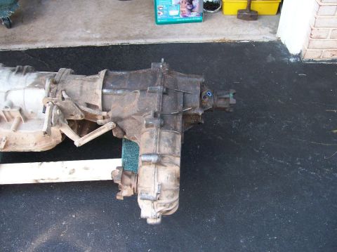 1989 Ford Bronco - Transfer case and transmission assembly shown removed from a vehicle.