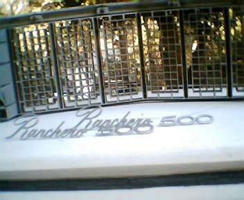 1973 Ford Ranchero - Close-up of a Ford Ranchero 500 grille, showing chrome accents and a textured pattern.