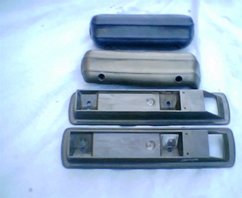 1973 Ford Ranchero - Four car armrest parts are shown, two in black and two in a tan finish.