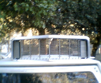 1973 Ford Ranchero - Close-up of a vehicle's grille, with the Supermotors.net logo in the lower right corner.