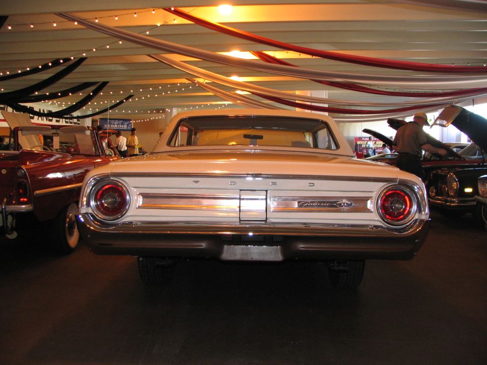 White 1962 Ford Galaxie rear view, chrome bumper, round taillights, "Galaxie" script on trunk lid