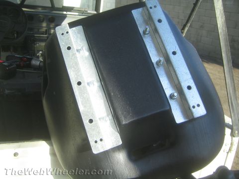 1987 Suzuki Samurai - Custom seat mounts are shown bolted to the base of a vehicle seat.