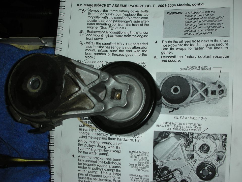 Service manual page section 8.2 Main Bracket Assembly Drive Belt with lettered steps and figures, with a tensioner part lying on it