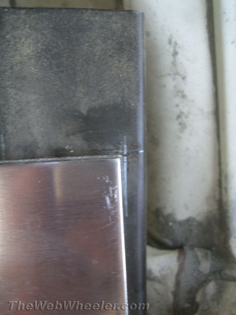 1987 Suzuki Samurai - A close-up view shows a section of brushed metal trim with visible scratches.
