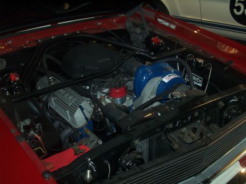 1972 Ford Ranchero - The engine bay features a prominent blue supercharger and a black Cobra air cleaner assembly, with visible branding indicating 'Supercharge…