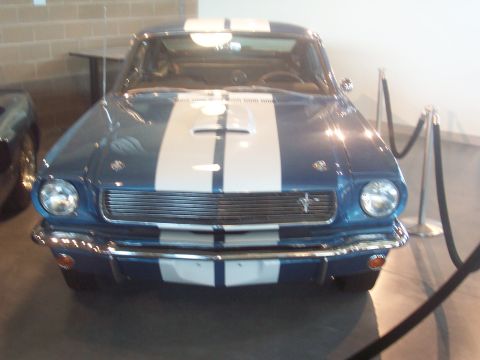 1972 Ford Ranchero - Front view of a blue coupe with white racing stripes and a distinctive hood scoop.