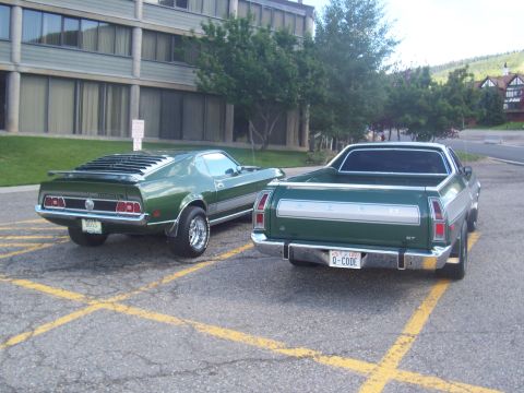 1972 Ford Ranchero - Two green Ford vehicles, a 1972 Ranchero and a 1971 Mustang, are parked side-by-side.