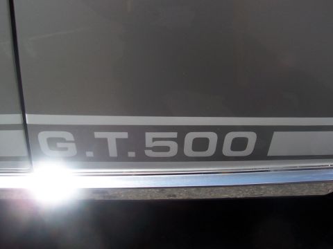 1972 Ford Ranchero - Close-up of a G.T. 500 decal on a silver vehicle's side panel.
