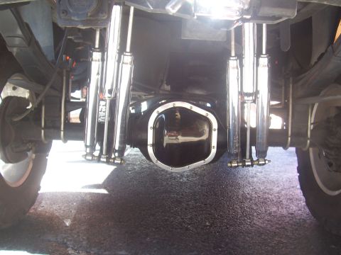 1972 Ford Ranchero - Underside view of a rear axle dual chrome shocks and a polished differential cover.