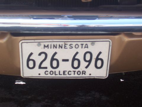 1972 Ford Ranchero - A Minnesota license plate reading 626-696 COLLECTOR is attached to the rear of a gold-colored vehicle.