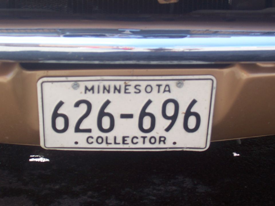 Gold vehicle rear with Minnesota license plate 626-696 COLLECTOR